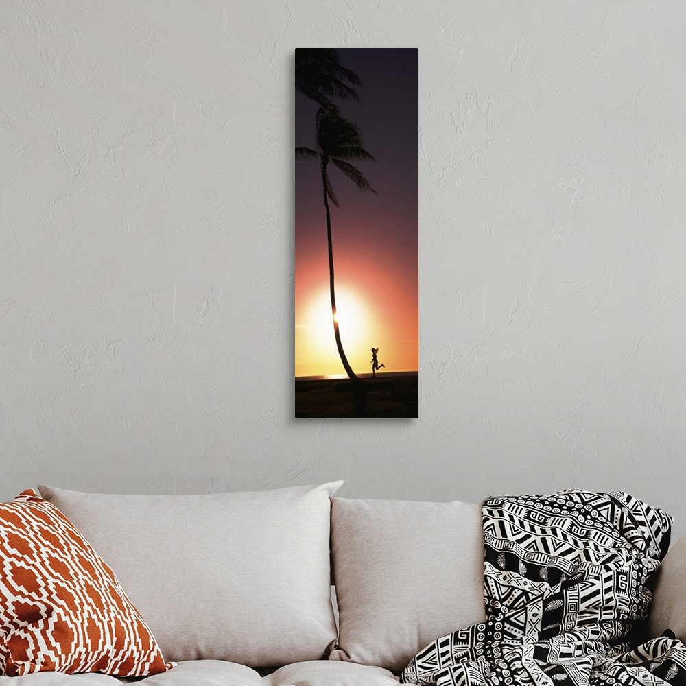 A bohemian room featuring Silhouette of a woman running on the beach, Magic Island, Hawaii