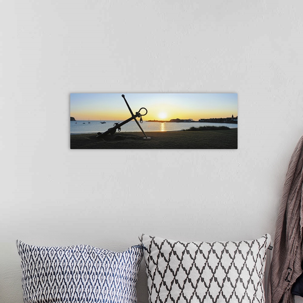 A bohemian room featuring Silhouette of an anchor on the beach at sunrise, North Berwick, East Lothian, Scotland