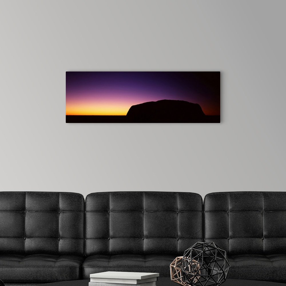 A modern room featuring Silhouette of Ayers Rock formations on a landscape, Northern Territory, Australia