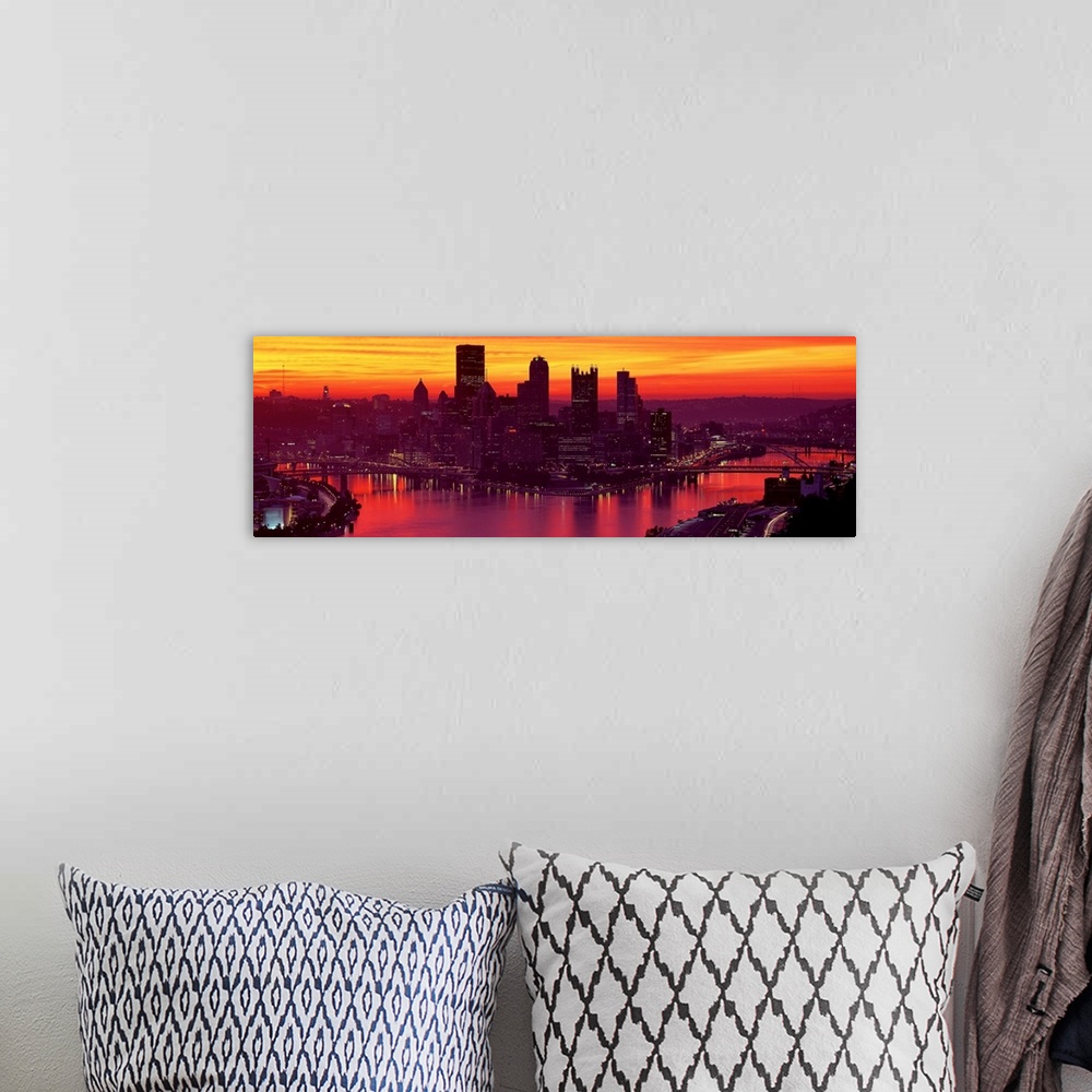 A bohemian room featuring Panoramic photograph of the view of the Pittsburgh skyline from down the Ohio River at sunset and...