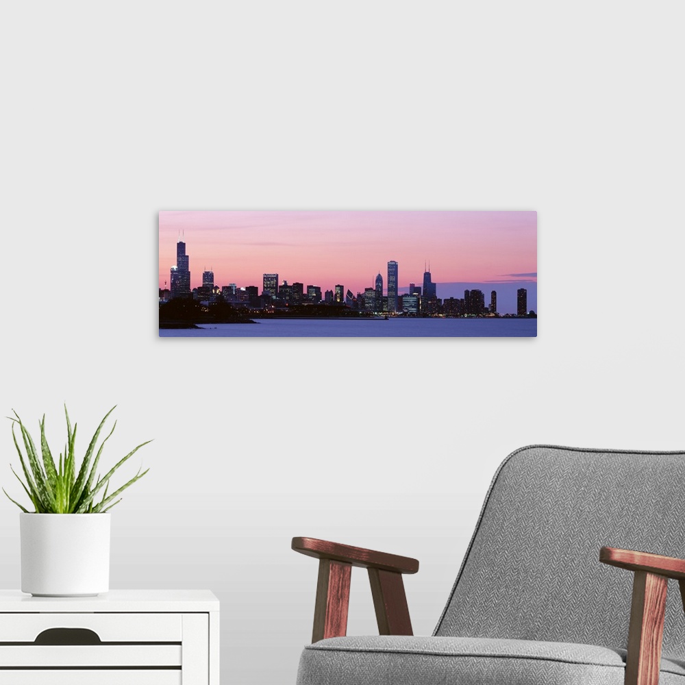 A modern room featuring Silhouette of buildings at dusk, Chicago, Illinois