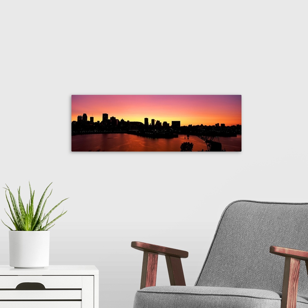 A modern room featuring Silhouette of buildings at dusk, Montreal, Quebec, Canada
