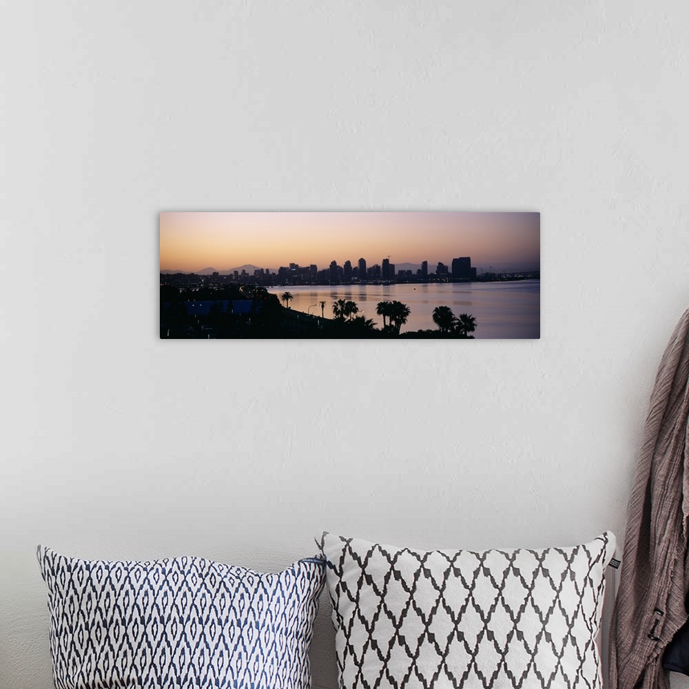 A bohemian room featuring Panoramic photograph taken from an aerial view overlooking the distant skyline of a busy city sit...