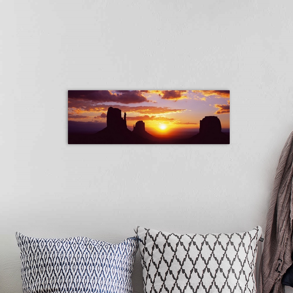 A bohemian room featuring Silhouette of buttes at sunset, Monument Valley, Utah, USA