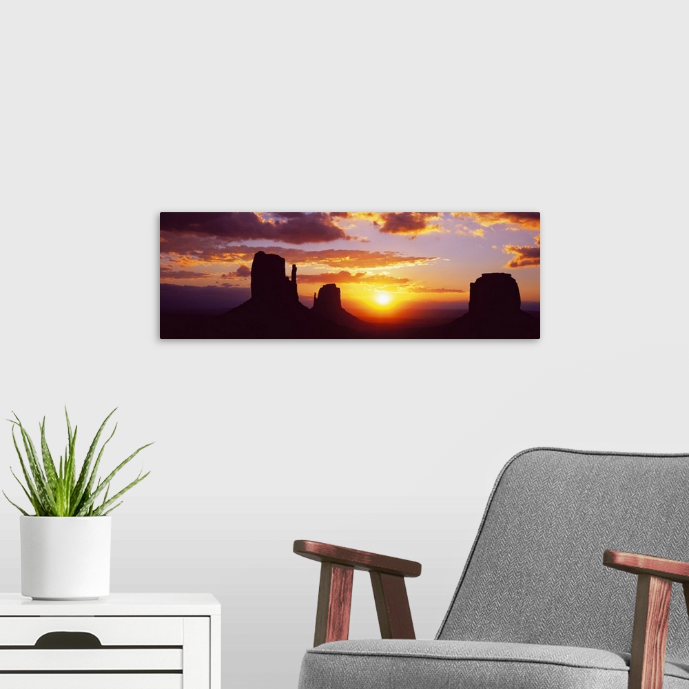 A modern room featuring Silhouette of buttes at sunset, Monument Valley, Utah, USA