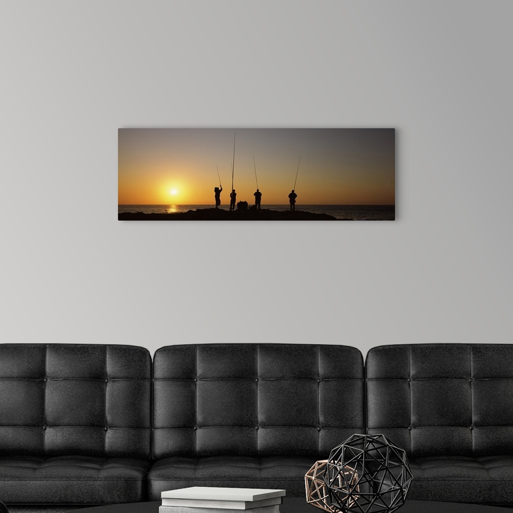 A modern room featuring Silhouette of fishermen fishing in river at sunset Scottburgh KwaZulu Natal South Africa