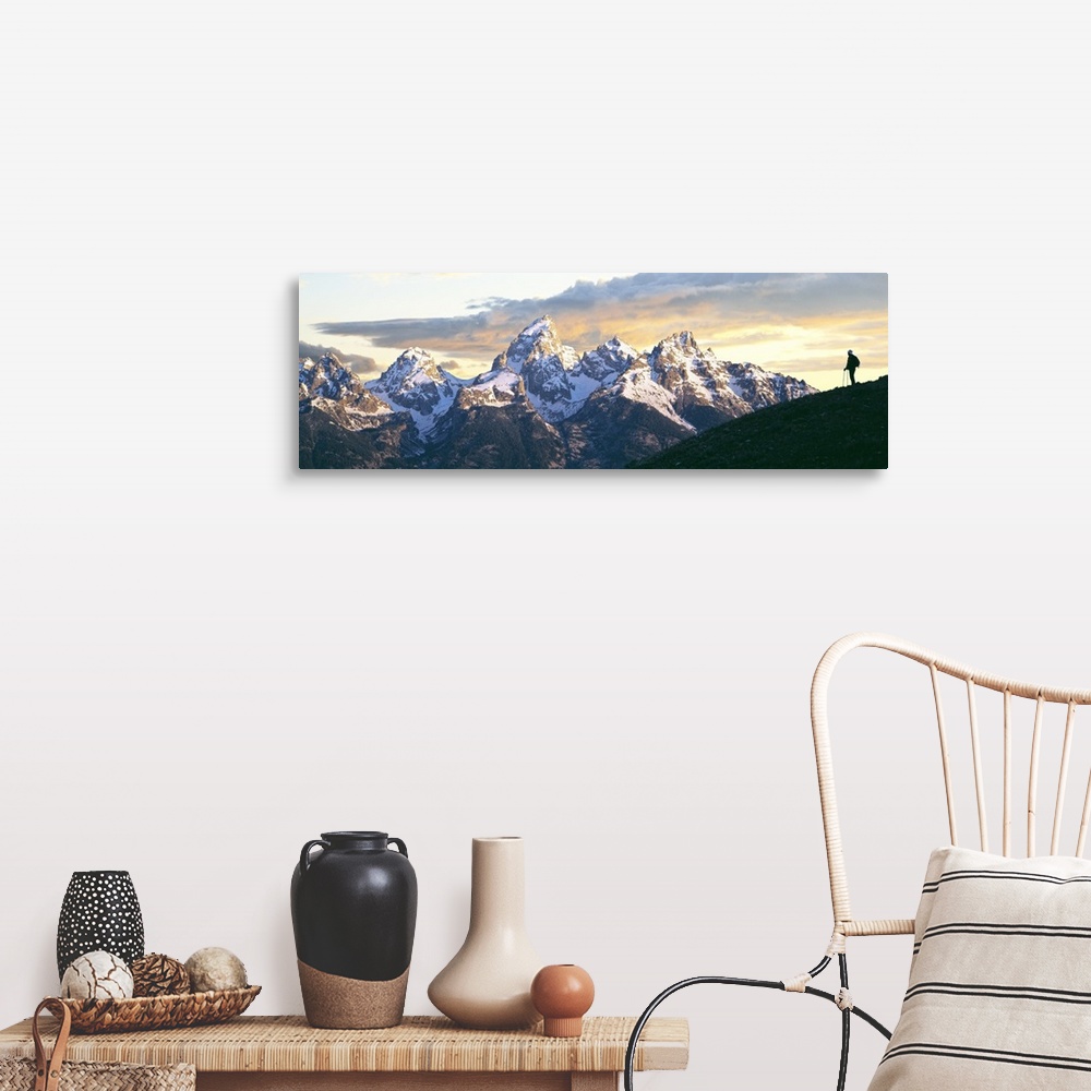 A farmhouse room featuring Silhouette of hiker looking at Teton Range from Schwabachers Landing, Grand Teton National Park, ...