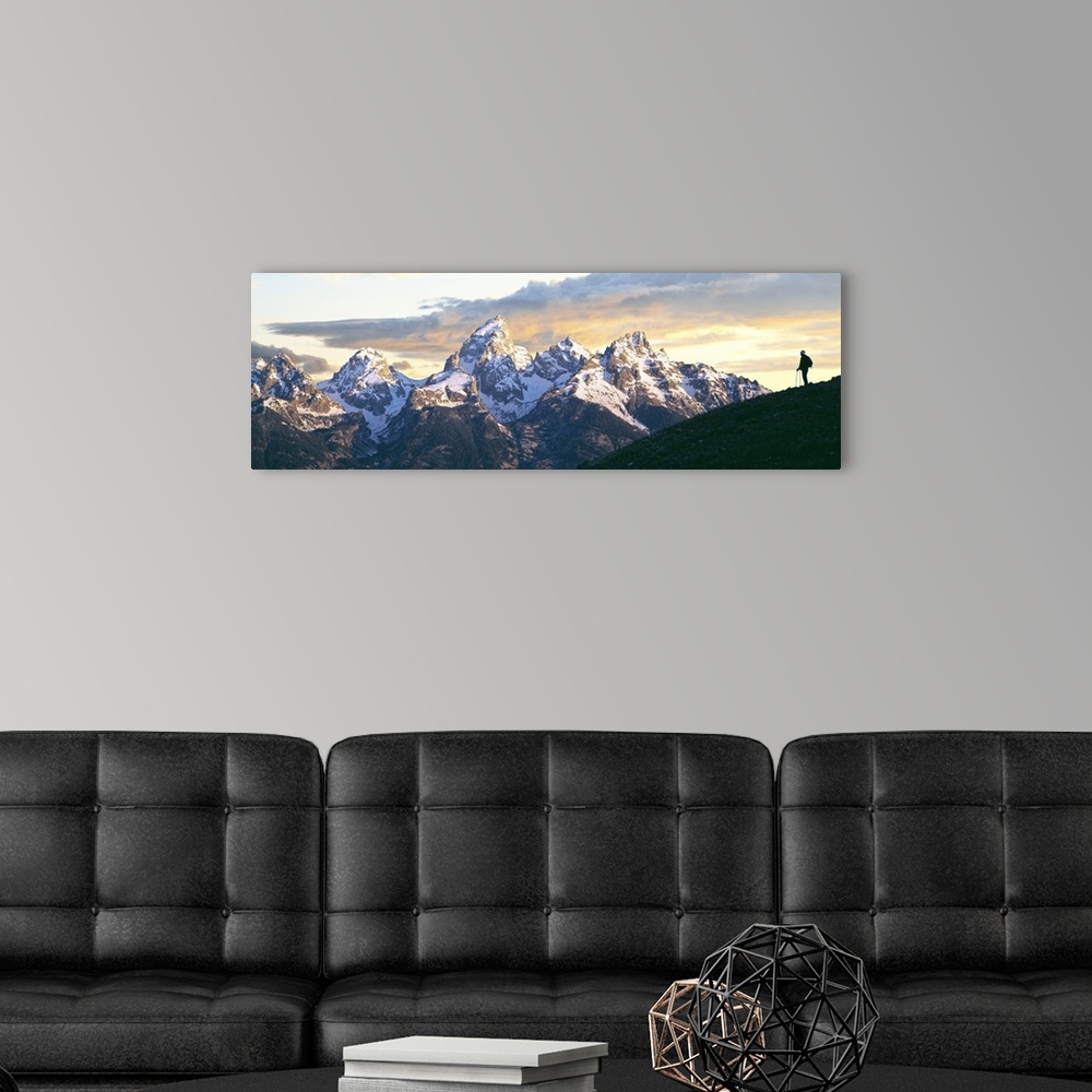 A modern room featuring Silhouette of hiker looking at Teton Range from Schwabachers Landing, Grand Teton National Park, ...