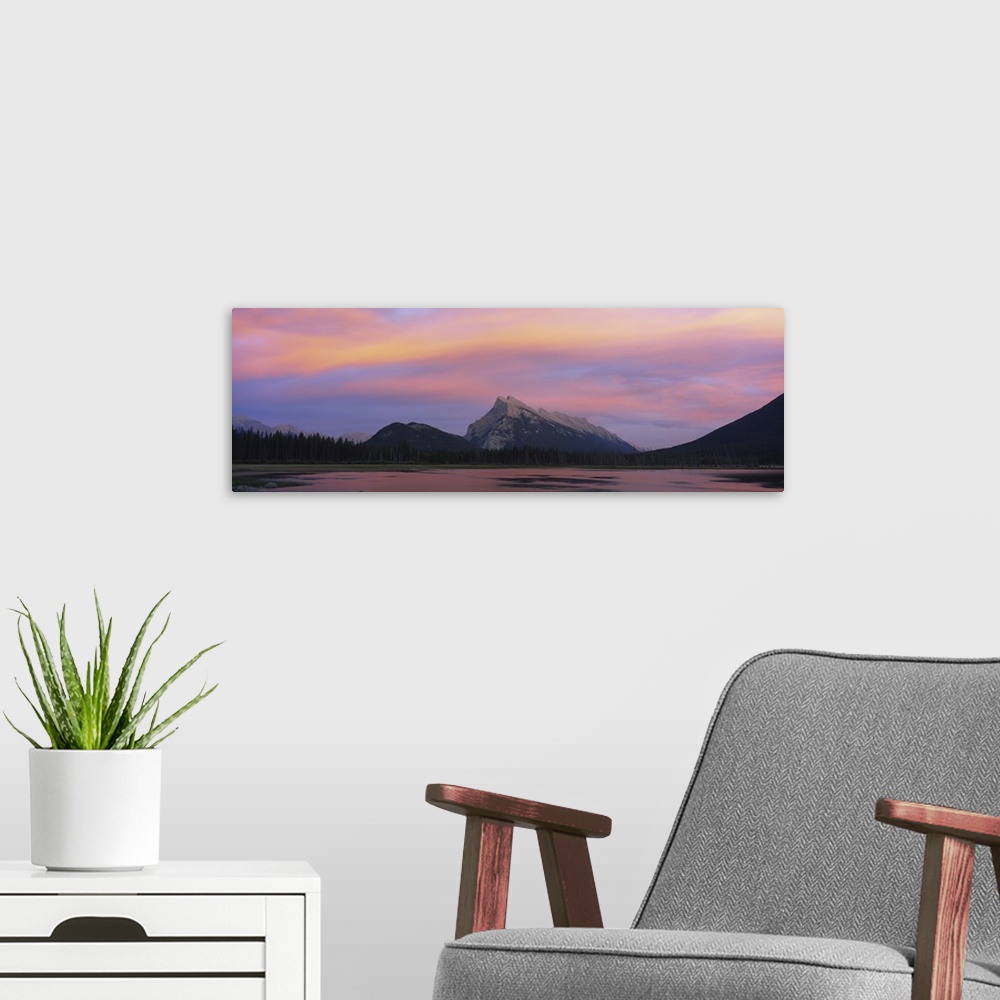A modern room featuring Silhouette of mountains on a landscape, Mount Rundle, Vermillion Lake, Banff, Alberta, Canada.