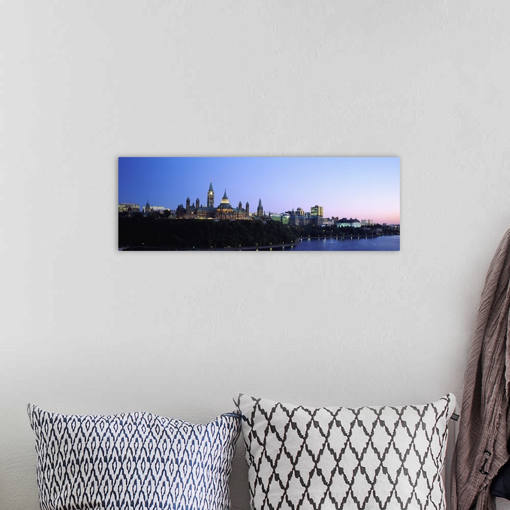 A bohemian room featuring Silhouette of parliament building along a lake, Ottawa, Ontario, Canada
