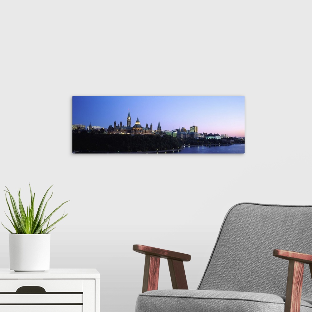 A modern room featuring Silhouette of parliament building along a lake, Ottawa, Ontario, Canada