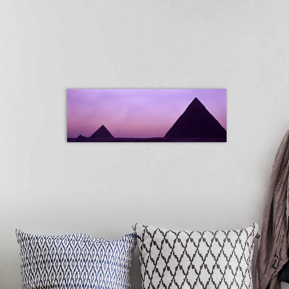 A bohemian room featuring Silhouette of pyramids at dusk, Giza, Egypt