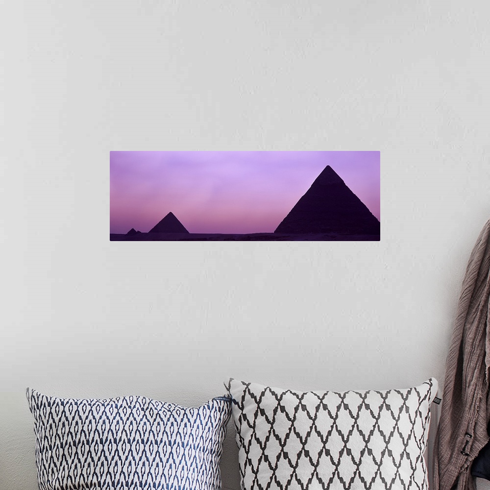 A bohemian room featuring Silhouette of pyramids at dusk, Giza, Egypt