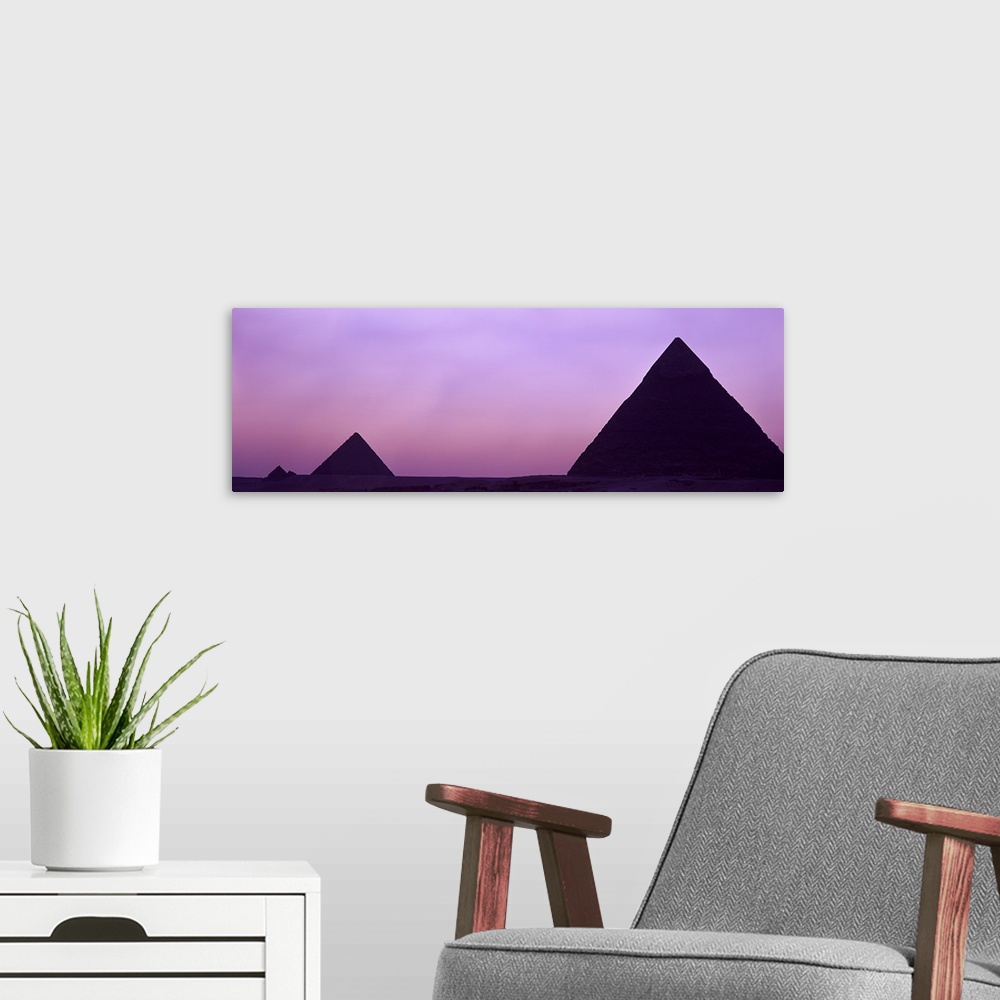 A modern room featuring Silhouette of pyramids at dusk, Giza, Egypt