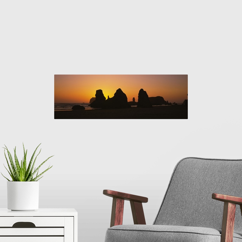 A modern room featuring Silhouette of rock formations at sunset, Pacific Ocean, Bandon State Natural Area, Bandon, Oregon