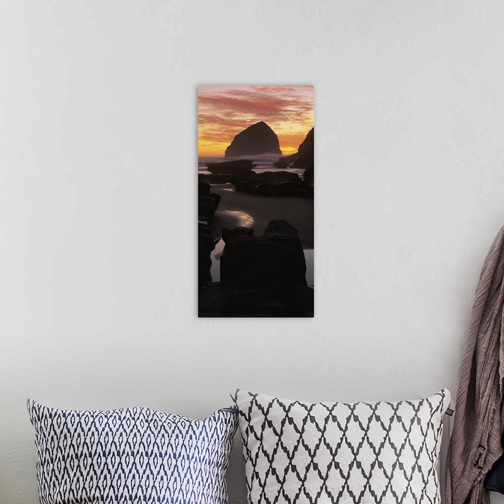 A bohemian room featuring Silhouette of rock formations on the beach, Haystack Rock, Cape Kiwanda State Park, Pacific City,...