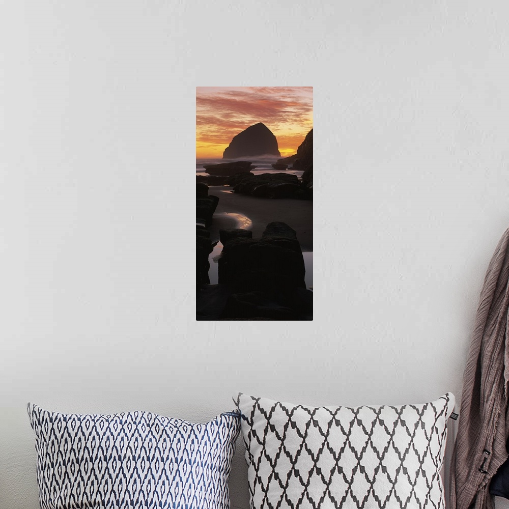 A bohemian room featuring Silhouette of rock formations on the beach, Haystack Rock, Cape Kiwanda State Park, Pacific City,...