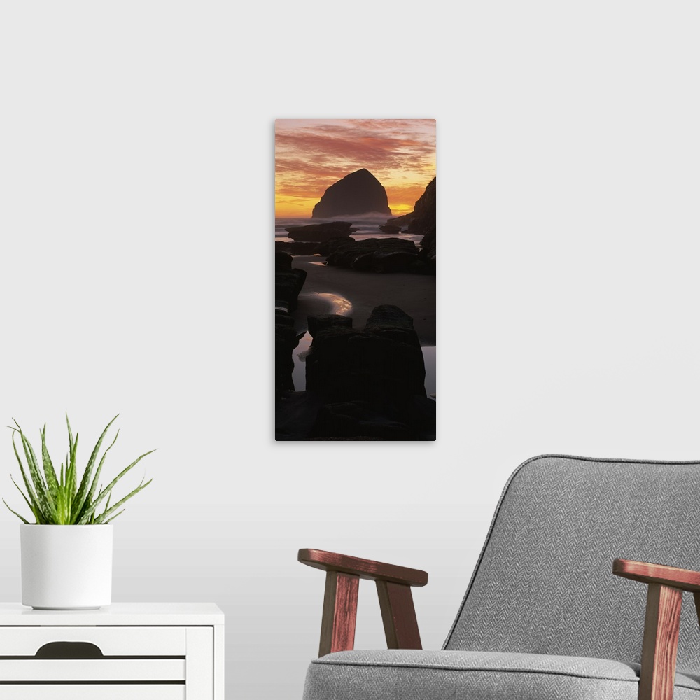 A modern room featuring Silhouette of rock formations on the beach, Haystack Rock, Cape Kiwanda State Park, Pacific City,...