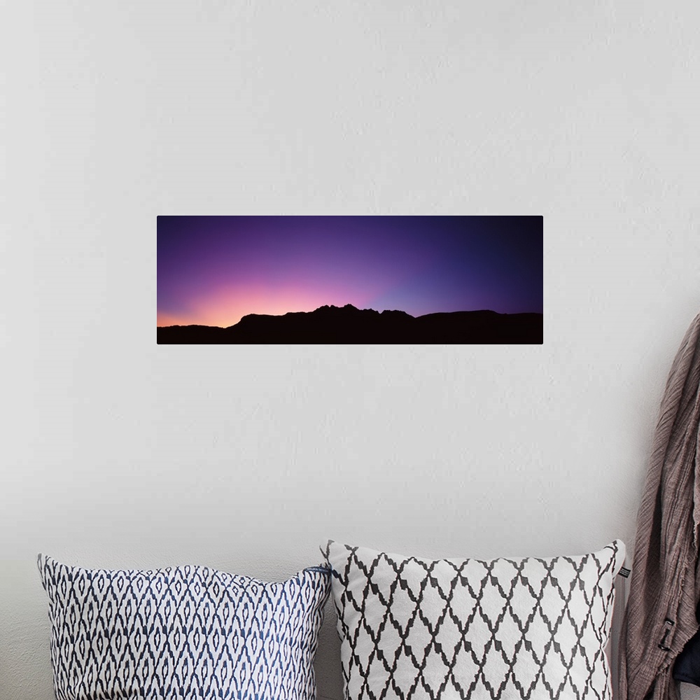 A bohemian room featuring A spectacular sunrise panorama featuring the Grand Canyon.