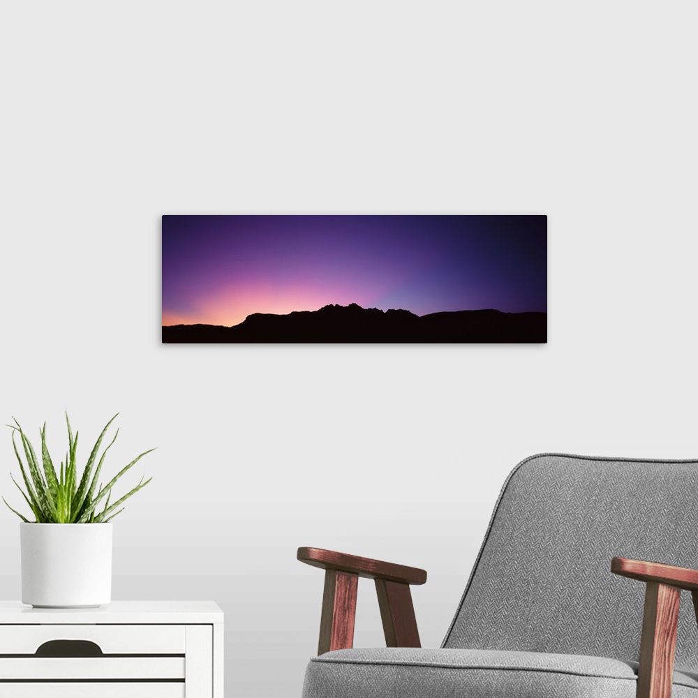 A modern room featuring A spectacular sunrise panorama featuring the Grand Canyon.