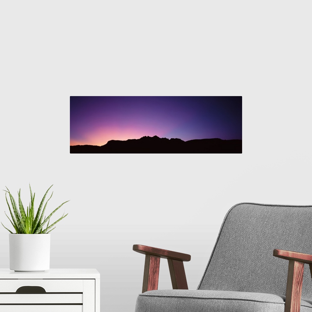 A modern room featuring A spectacular sunrise panorama featuring the Grand Canyon.