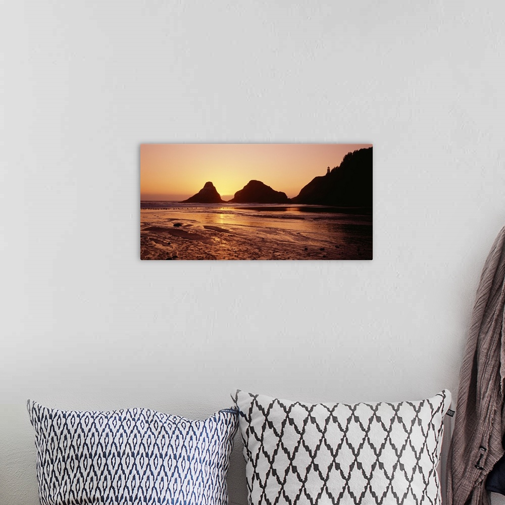 A bohemian room featuring Silhouette of rocks at sunset, Heceta Head Lighthouse, Devils Elbow State Park, Oregon