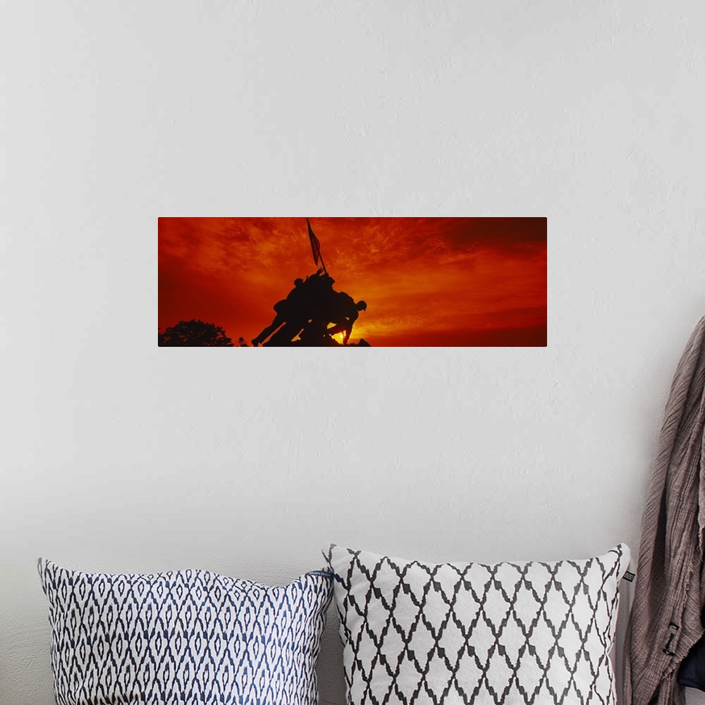 A bohemian room featuring Big, panoramic photograph of the silhouette of the Iwo Jima Memorial, against a fiery sunset in  ...