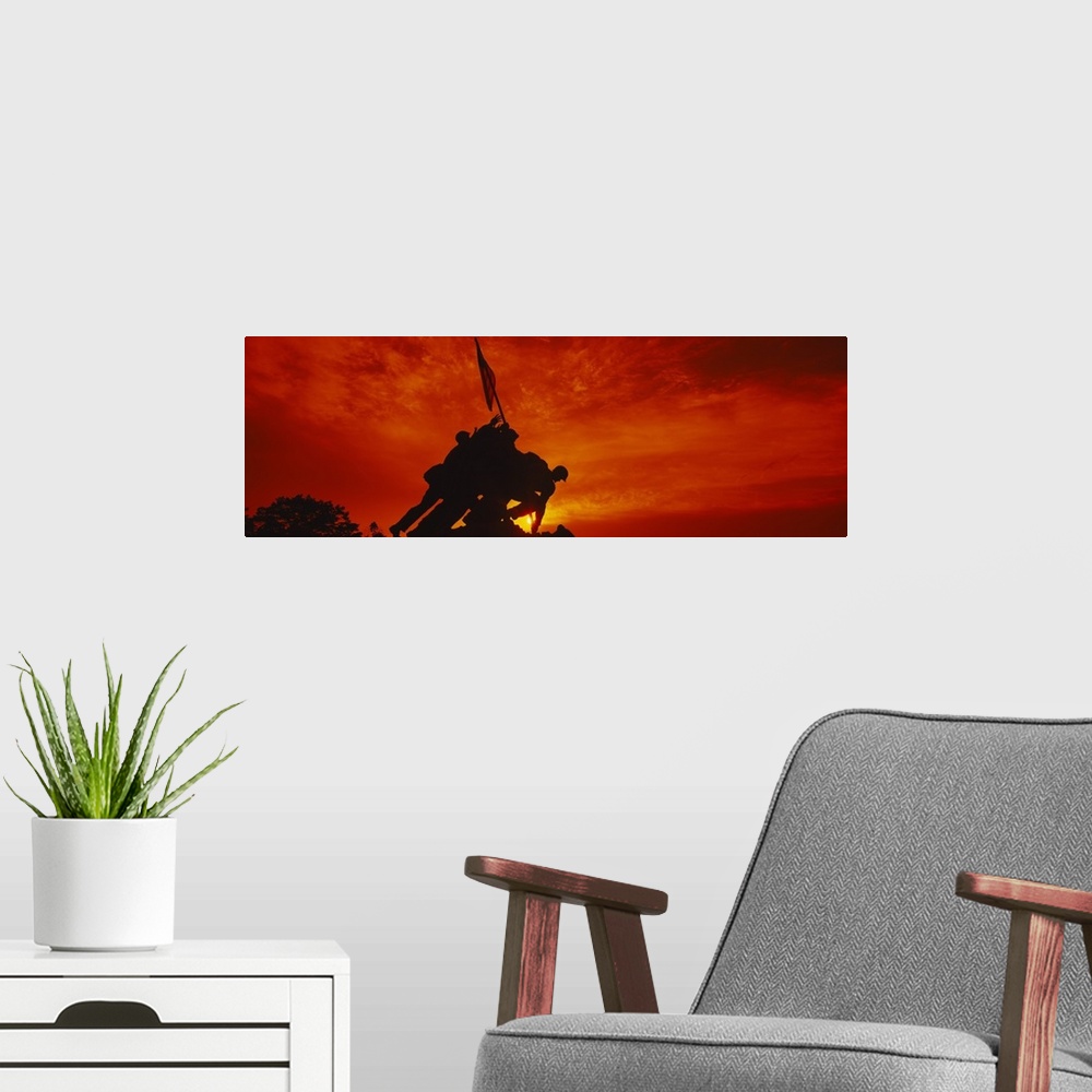 A modern room featuring Big, panoramic photograph of the silhouette of the Iwo Jima Memorial, against a fiery sunset in  ...