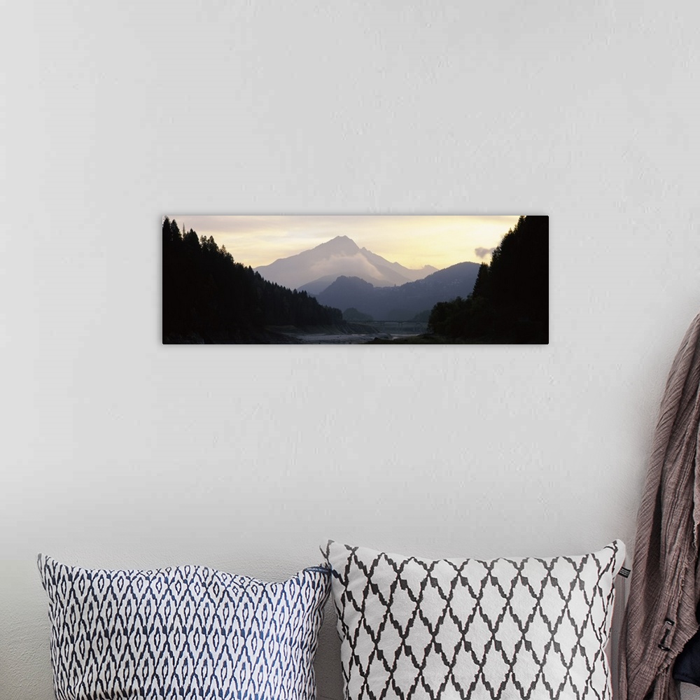 A bohemian room featuring Silhouette of trees with a mountain range in the background, Dolomites, Cadore, Province of Bellu...