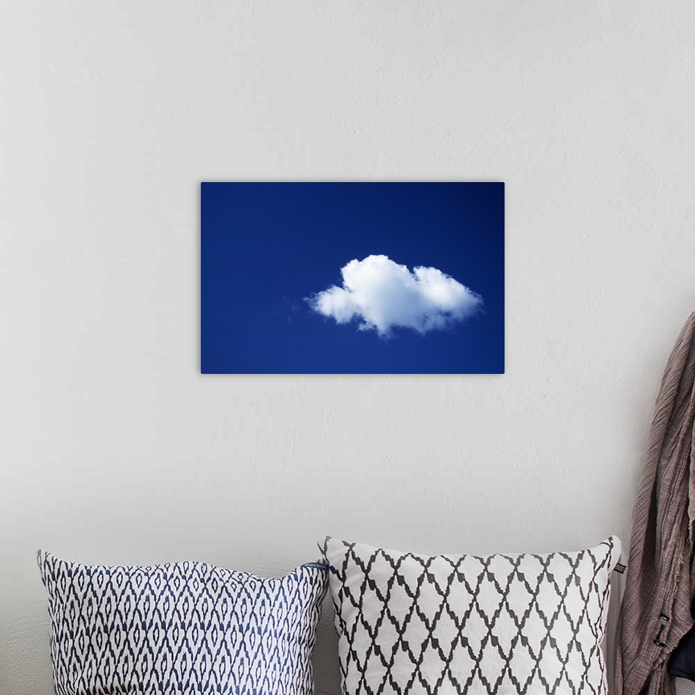 A bohemian room featuring Single white cloud, blue sky.
