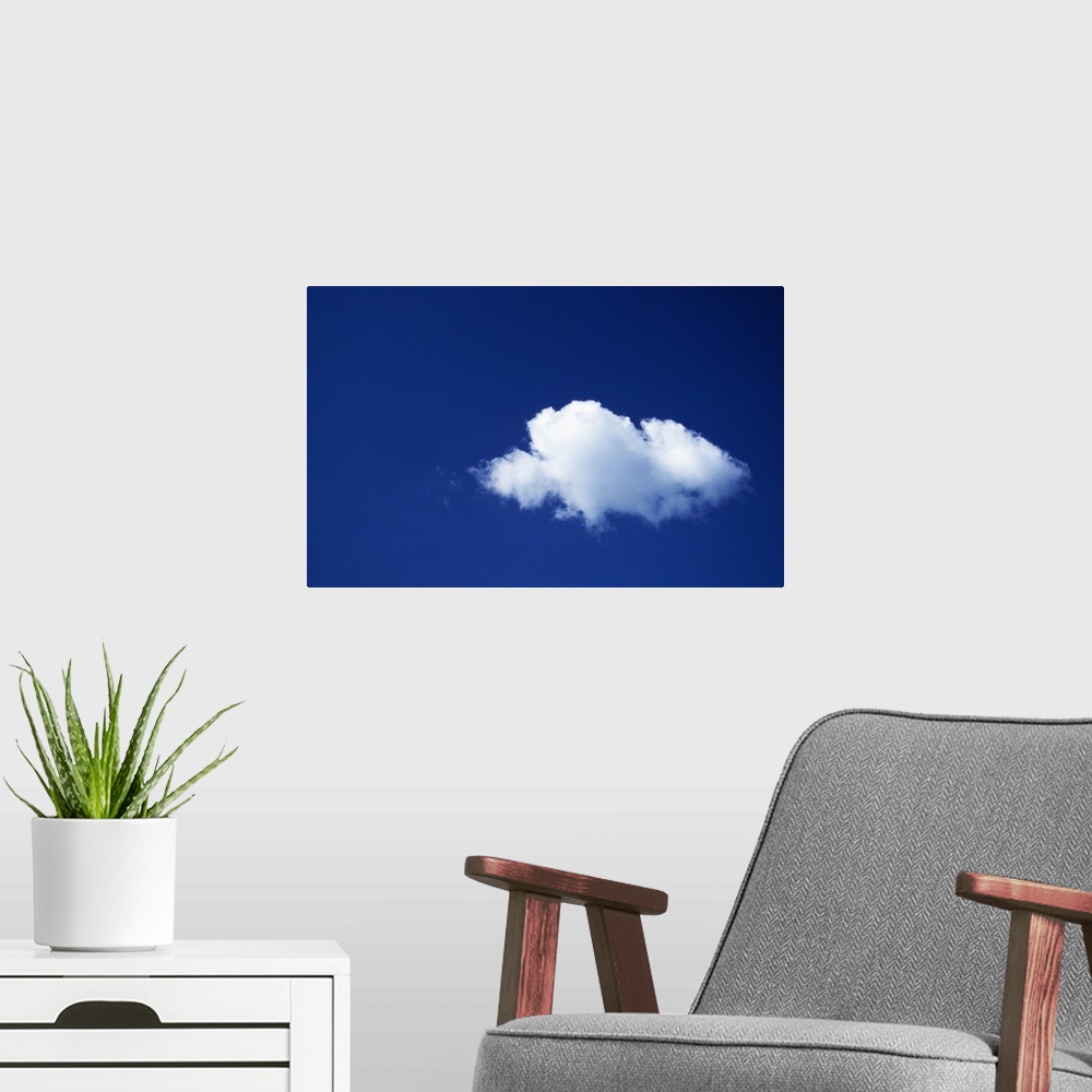 A modern room featuring Single white cloud, blue sky.