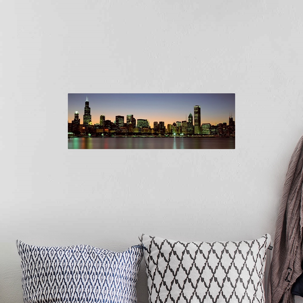A bohemian room featuring Panoramic photograph of the Chicago skyline across Lake Michigan at nightfall with the Sears Towe...