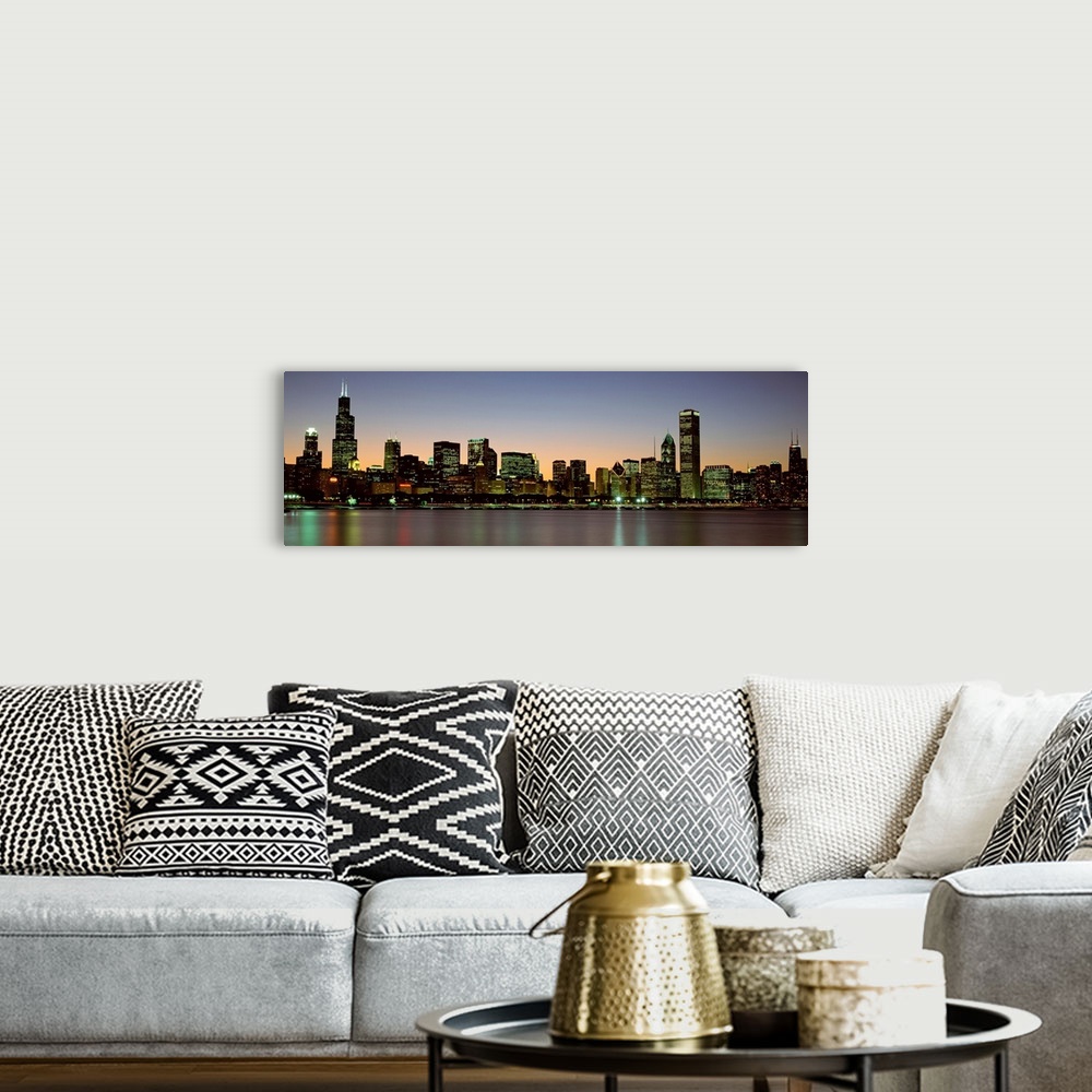 A bohemian room featuring Panoramic photograph of the Chicago skyline across Lake Michigan at nightfall with the Sears Towe...
