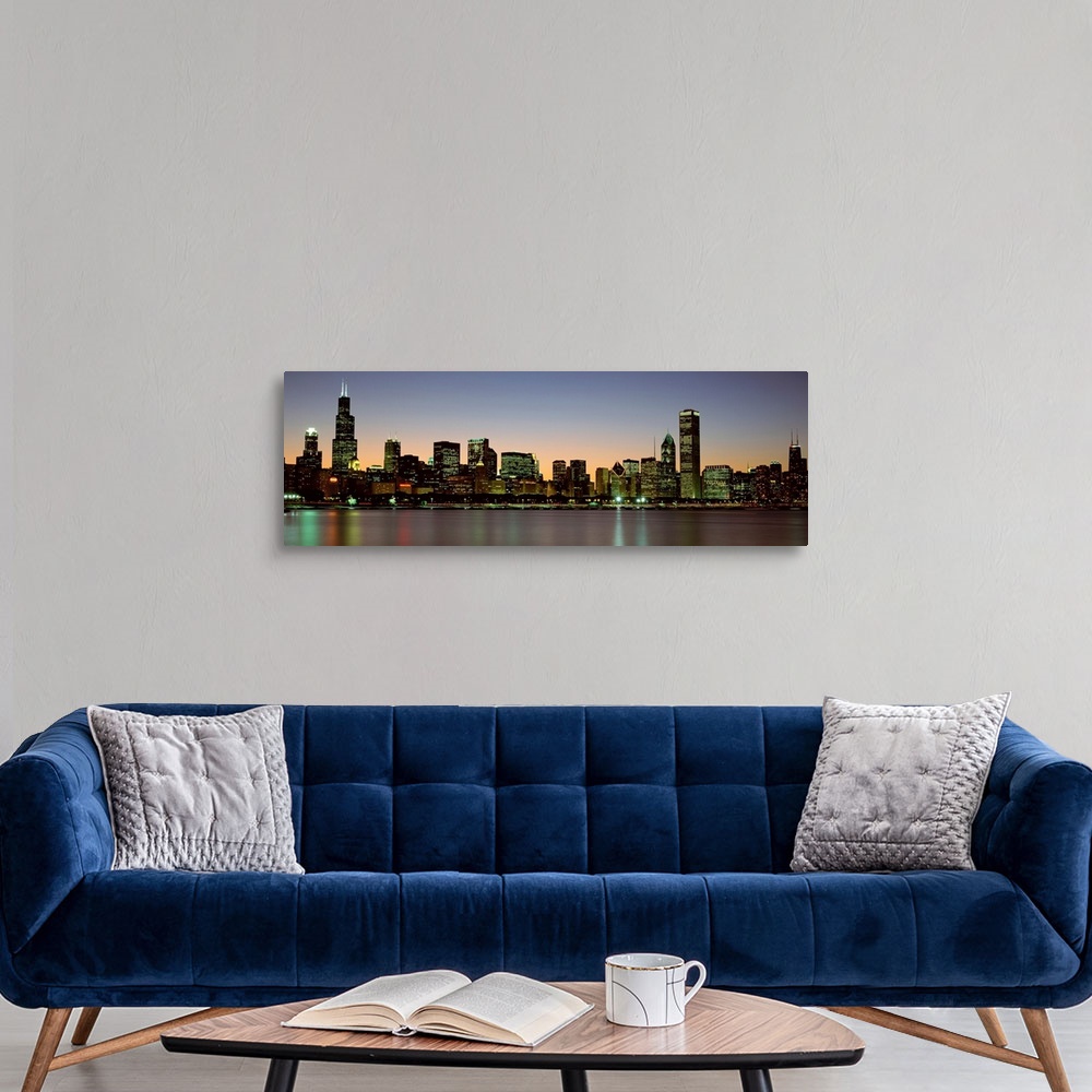 A modern room featuring Panoramic photograph of the Chicago skyline across Lake Michigan at nightfall with the Sears Towe...