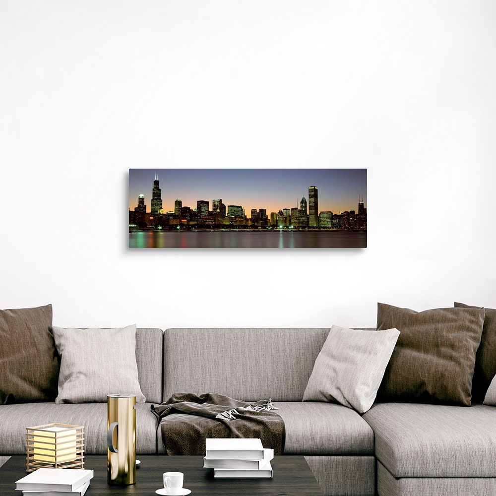 A traditional room featuring Panoramic photograph of the Chicago skyline across Lake Michigan at nightfall with the Sears Towe...