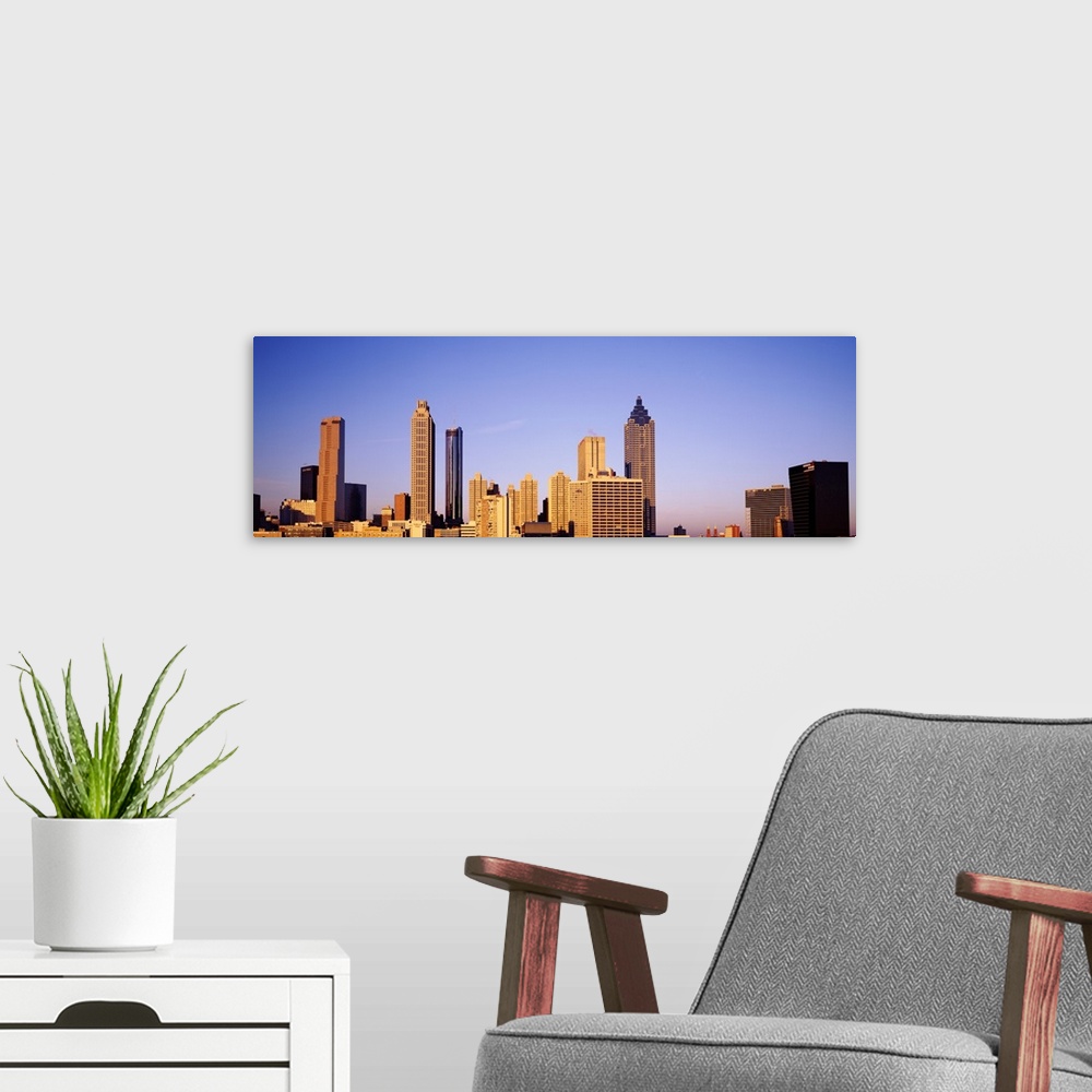 A modern room featuring Atlanta downtown skyline during the day.