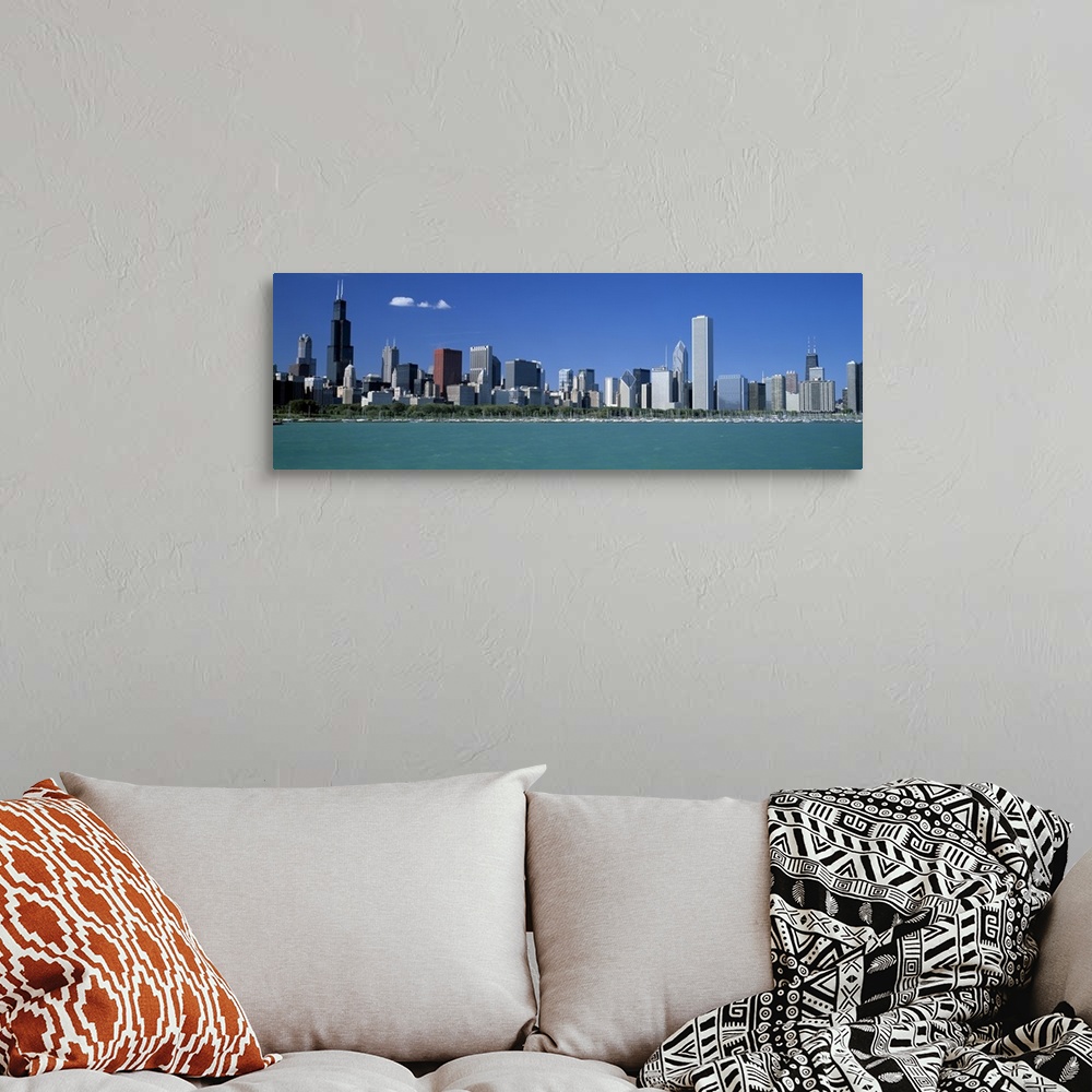 A bohemian room featuring Panoramic photograph shows a row of skyscrapers in the Midwestern United States overlooking the c...