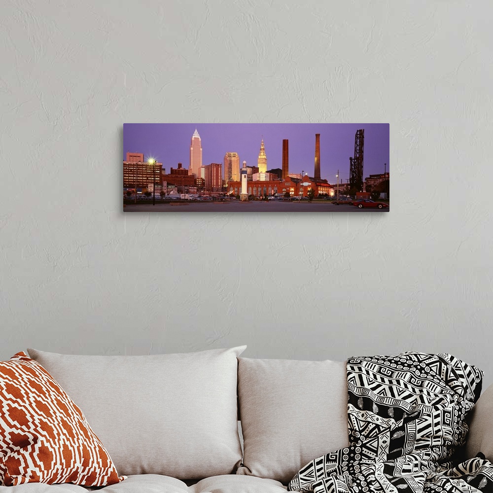 A bohemian room featuring Panoramic photograph of skyscrapers in Cleveland, Ohio, lit up at night.