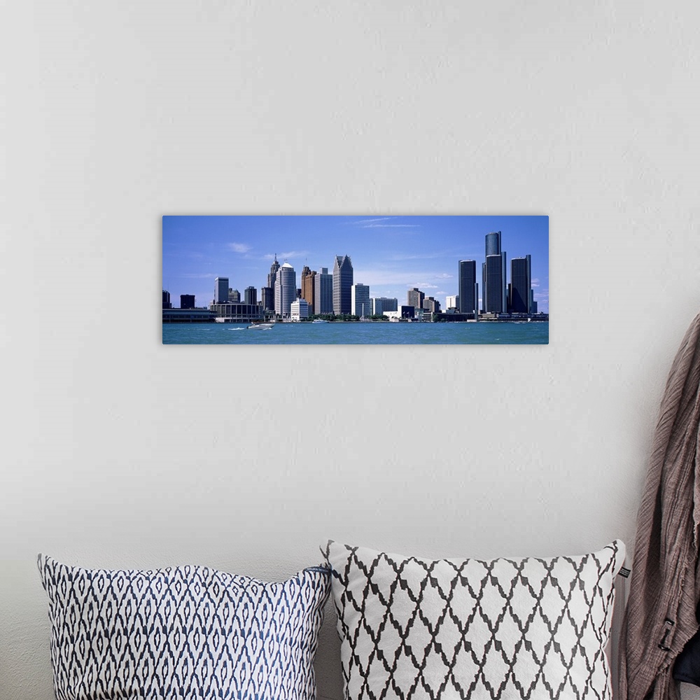 A bohemian room featuring Panoramic photograph taken of the Detroit skyline during the day with a body of water shown in fr...