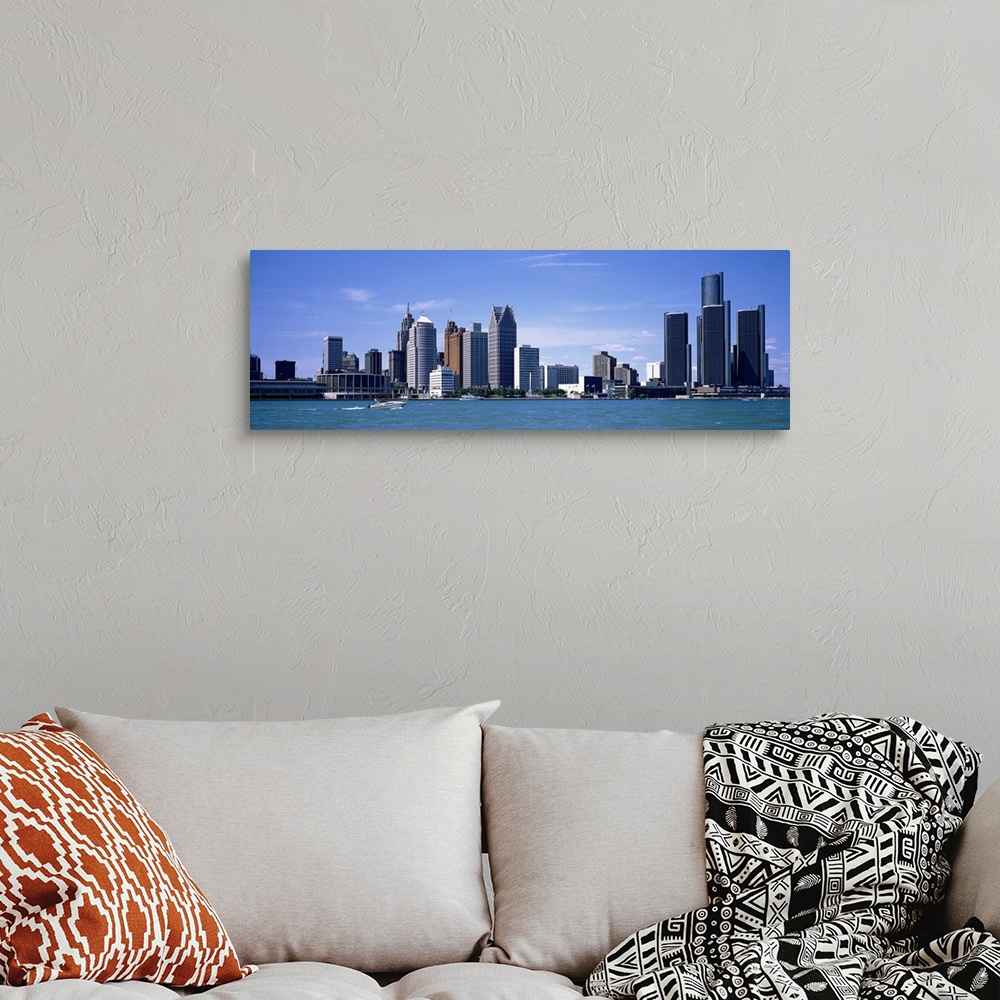 A bohemian room featuring Panoramic photograph taken of the Detroit skyline during the day with a body of water shown in fr...