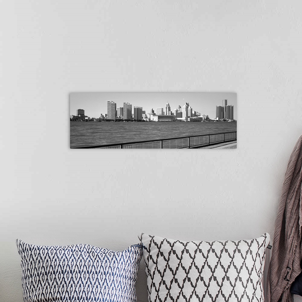 A bohemian room featuring This panoramic photograph is in black and white and taken of the Detroit skyline from across the ...