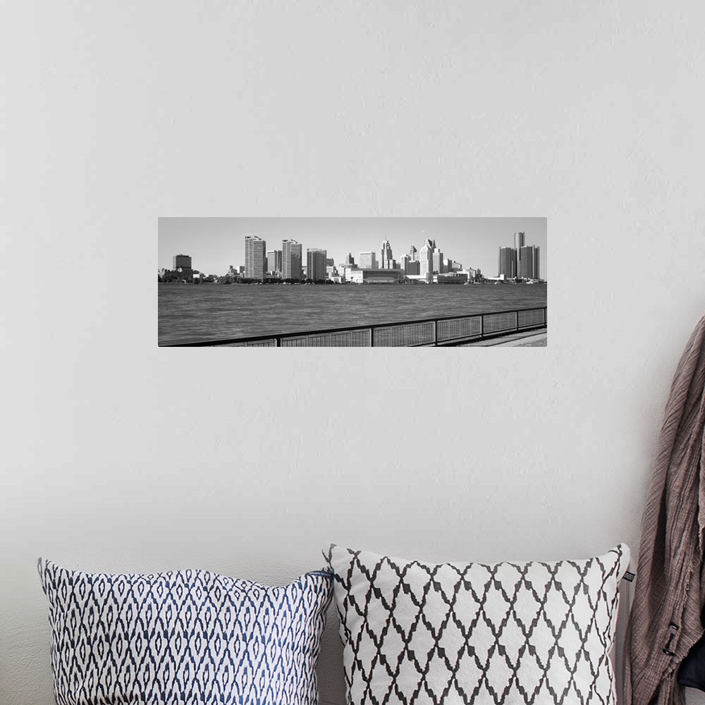 A bohemian room featuring This panoramic photograph is in black and white and taken of the Detroit skyline from across the ...