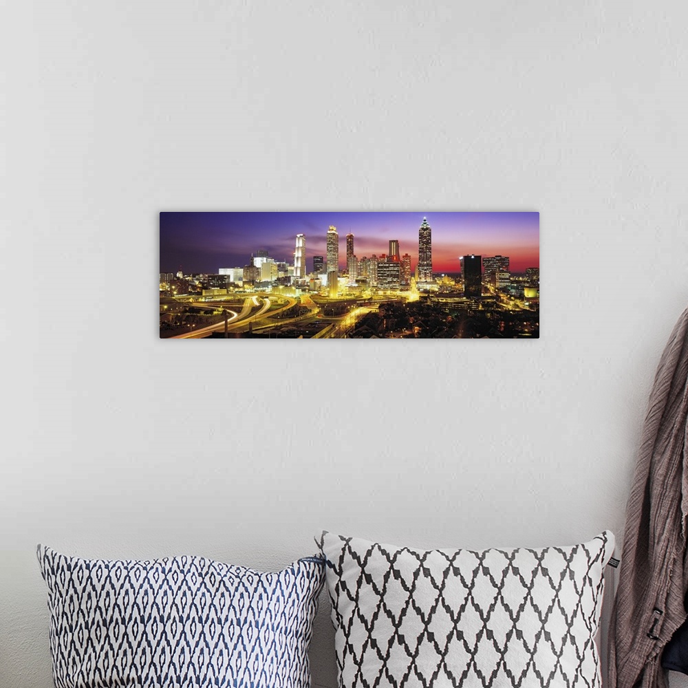 A bohemian room featuring Panoramic photograph of cityscape at night with buildings and streets lit up in the dark colorful...