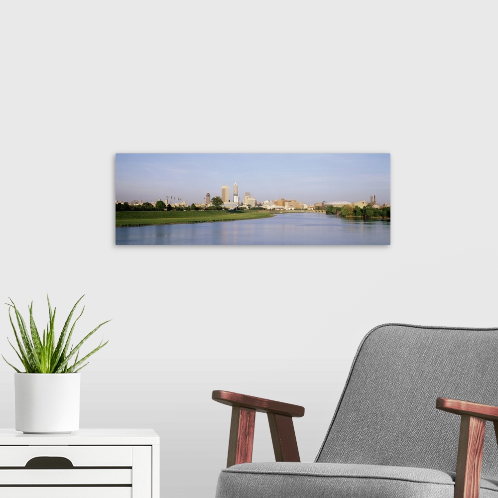 A modern room featuring Panoramic photo on canvas of the cityscape of Indianapolis along the waterfront.