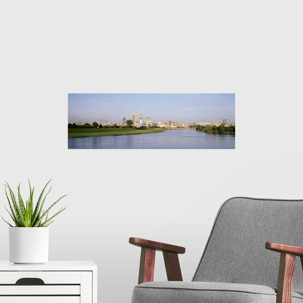 A modern room featuring Panoramic photo on canvas of the cityscape of Indianapolis along the waterfront.