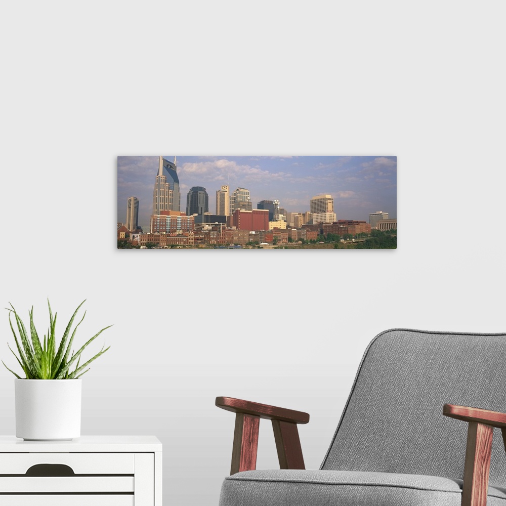 A modern room featuring Large horizontal panoramic photograph of the downtown Nashville, Tennesee (TN) skyline with skysc...