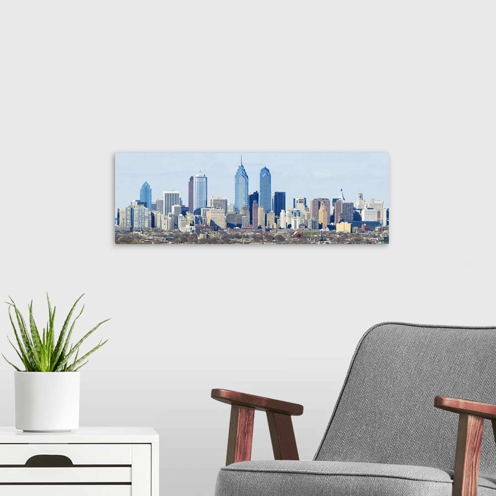 A modern room featuring Panoramic photo of the cityscape of Philadelphia at daytime.