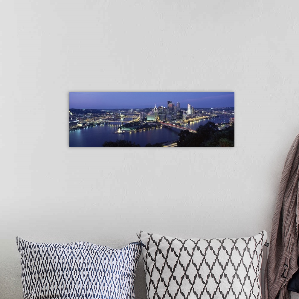 A bohemian room featuring Large panoramic photo of downtown Pittsburgh, Pennsylvania (PA) lit up at night. Multiple bridges...