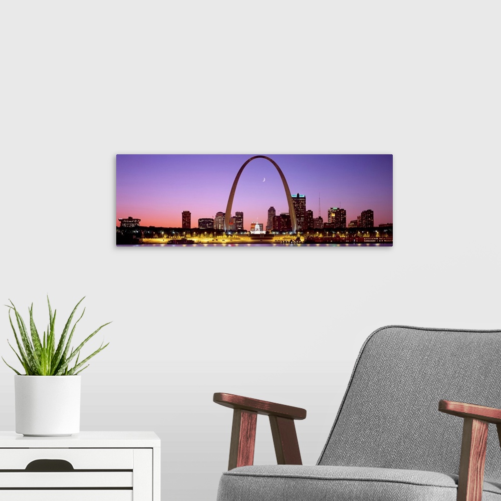 A modern room featuring Panoramic photograph shows the skyline of St. Louis, Missouri reflecting into the Mississippi Riv...