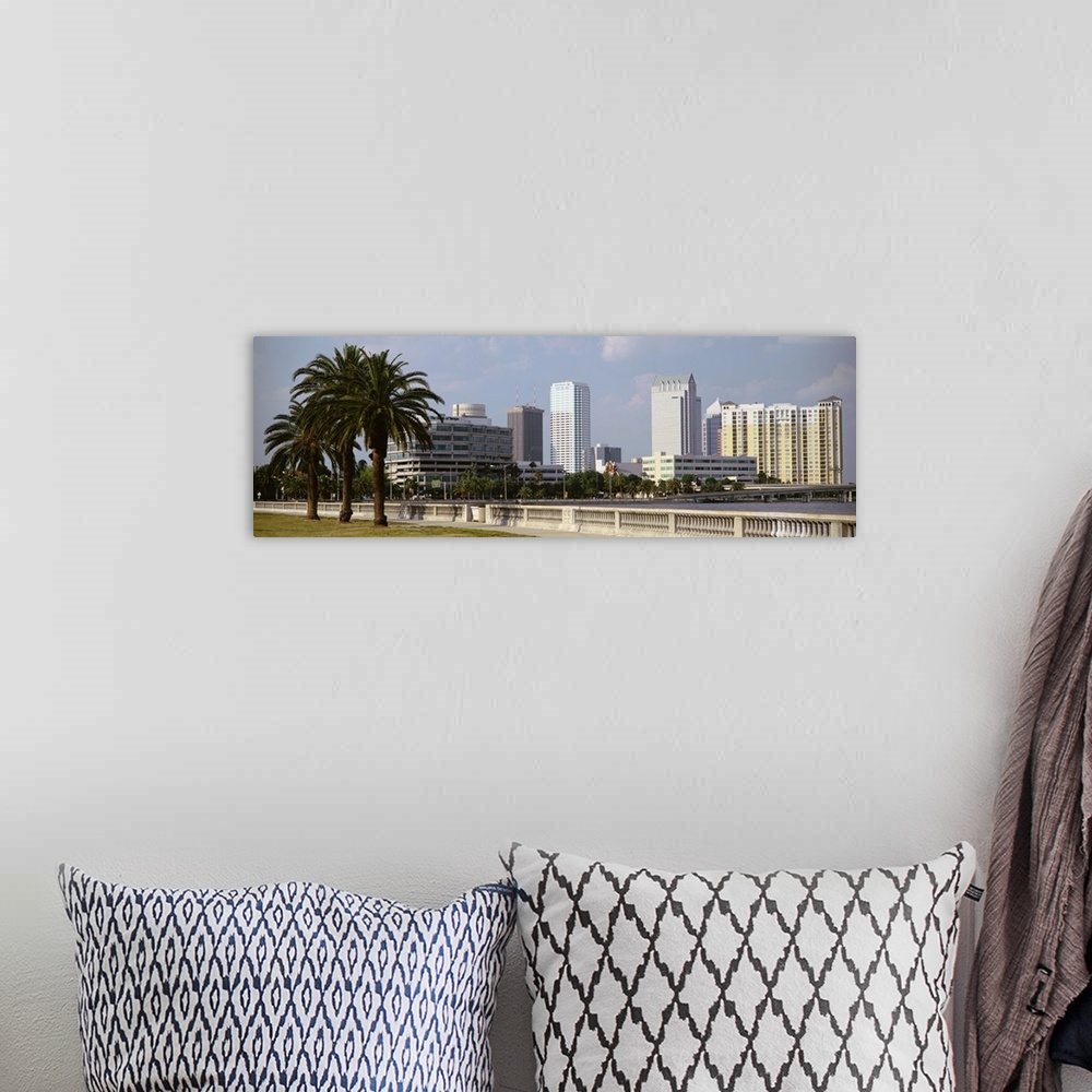 A bohemian room featuring The skyline in Tampa is photographed from across the body of water that sits in front of it. Larg...